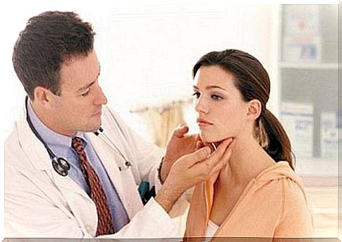 The doctor examines the woman's neck