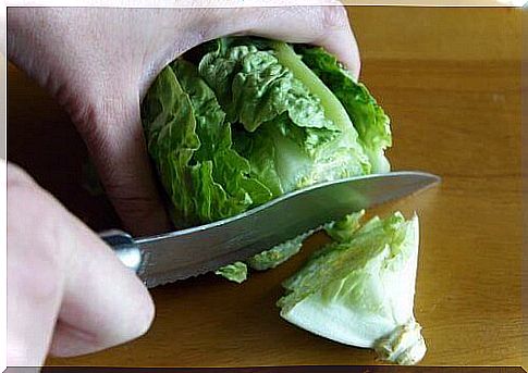 man cuts a salad